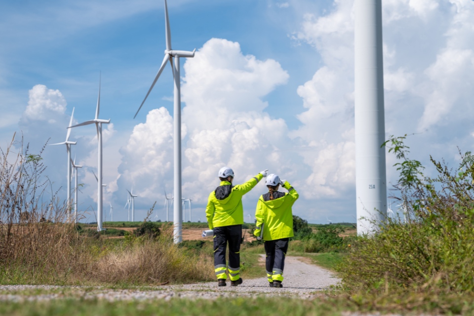 Two Colleagues Walking Control Wind Power.Split Block 960X640
